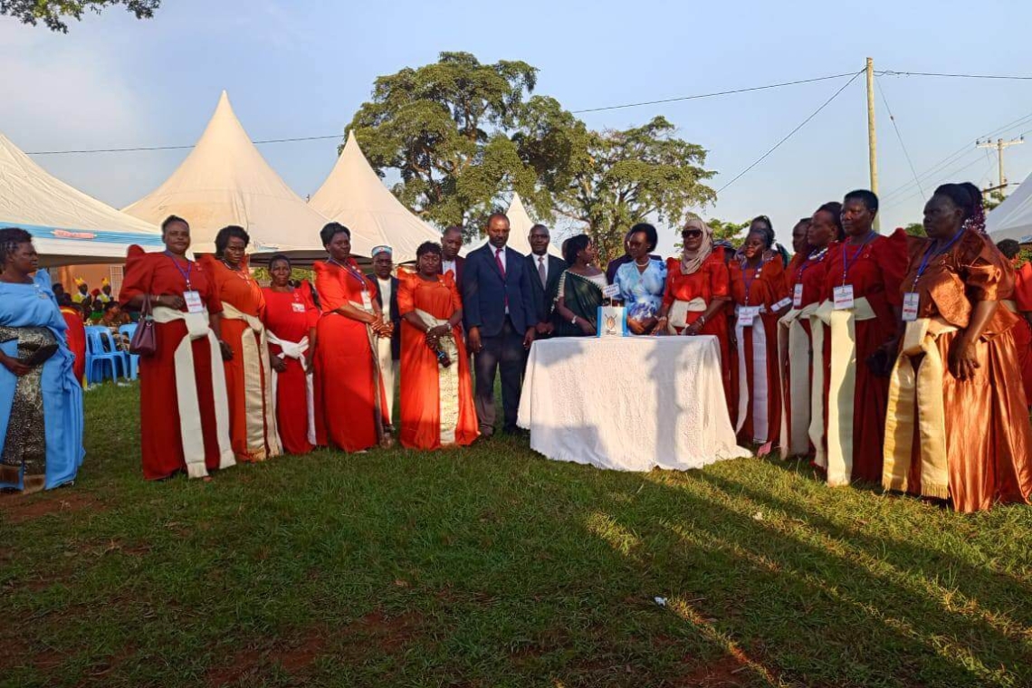 Women cutting the cake with Hon. Mariam Mayanja in Bulemezi county Women cutting the cake with Hon. Mariam Mayanja in Bulemezi county